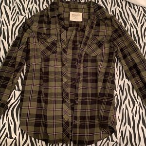 A green long sleeve flannel shirt